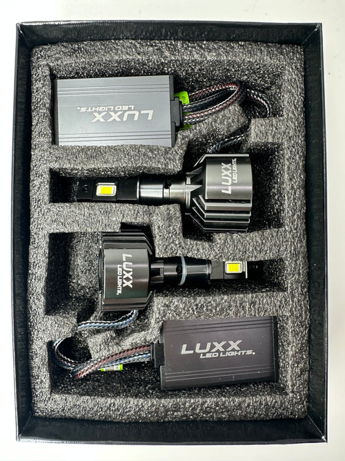 Luxx 9006 LED bulb pair and decoders inside the box